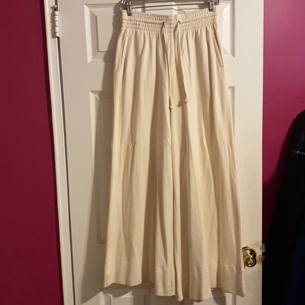 100% cotton wide leg creme colored draw string pants.